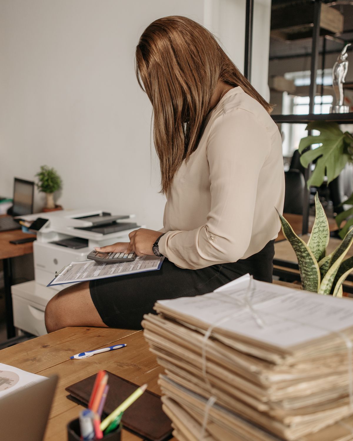 A school bursar at her desk in the finance office