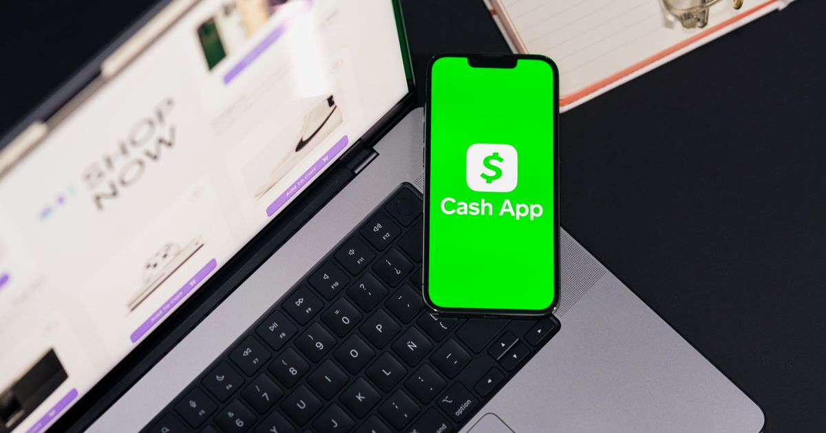 Banking app displayed on a phone and laptop