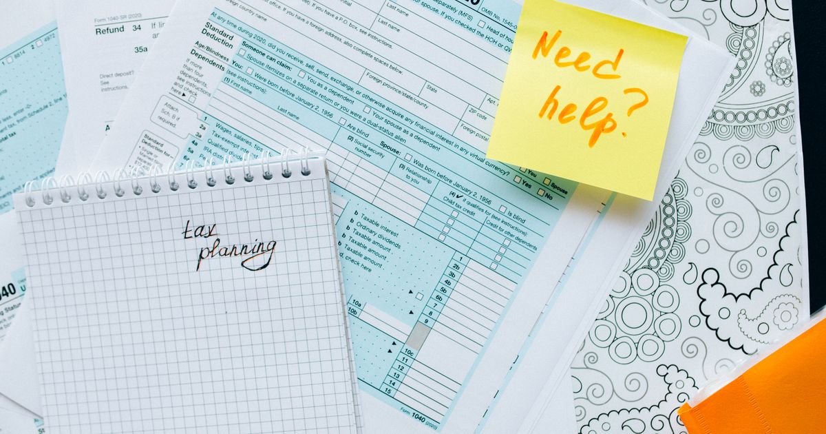 Financial documents with a calculator on a desk
