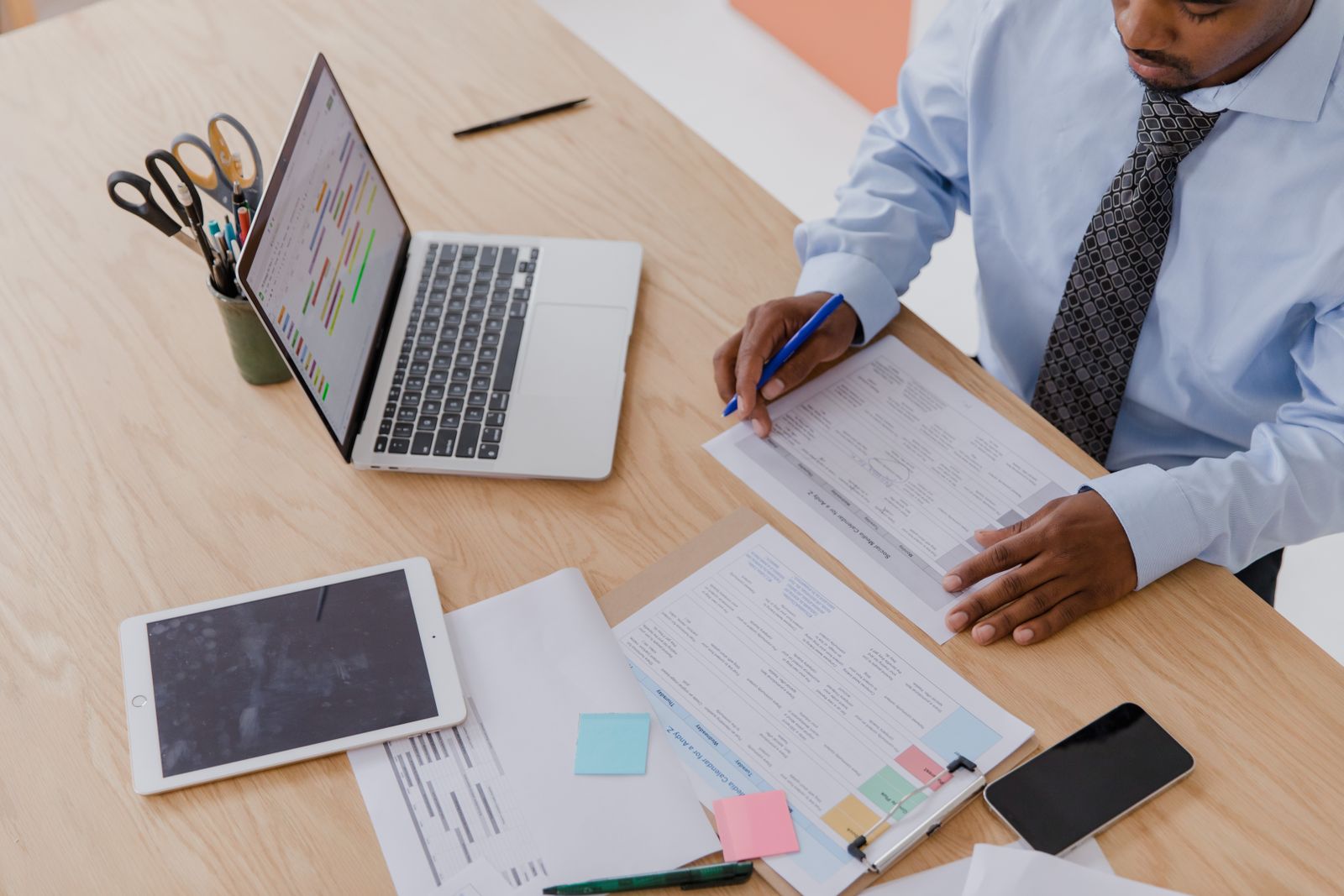 Financial documents and charts being reviewed on a desk
